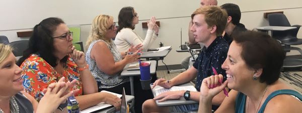 Educators are participating in a group session.